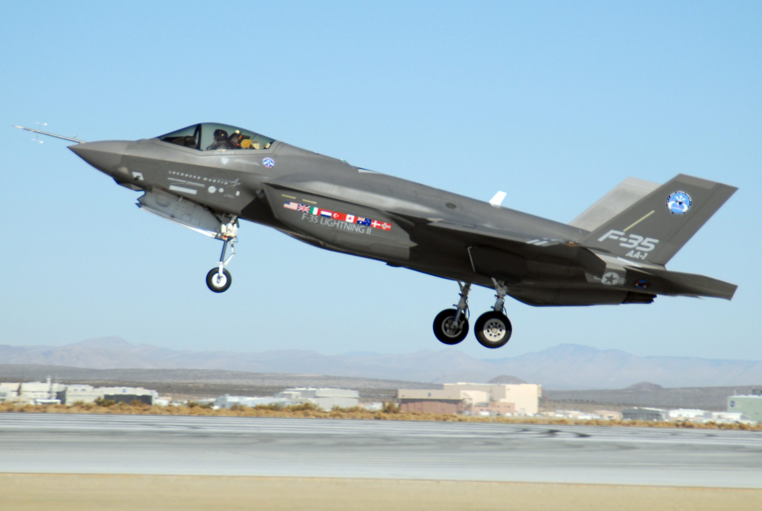 An F-35 Joint Strike Fighter, marked AA-1, lands Oct. 23 at Edwards Air Force Base, Calif. The F-35 Integrated Test Force staff concluded an air-start test. (U.S. Air Force photo/Senior Airman Julius Delos Reyes)