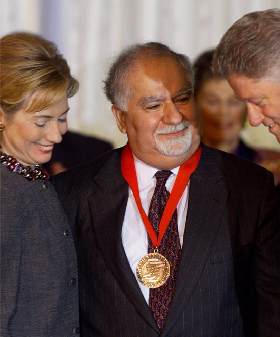 FILE - In this Nov. 5, 1998, file photo, President and Mrs. Clinton flank Vartan Gregorian, an educator, administrator and philanthropist from New York, after presenting him with a 1998 National Humanities Medal during a ceremony at the White House in Washington. Gregorian, the noted scholar and philanthropic leader who has led the Carnegie Corporation of New York since 1997, died Thursday, April 15, 2021, after being hospitalized for stomach pain. He was 87. (AP Photo/Doug Mills, File)