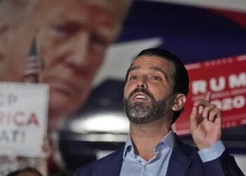 FILE - In this Nov. 5, 2020, file photo Donald Trump Jr., gestures during a news conference at Georgia Republican Party headquarters in Atlanta. A spokesman says President Donald Trump’s eldest son, Donald Trump Jr., has been infected with the coronavirus.  The spokesman says the younger Trump learned his diagnosis earlier this week, has no symptoms and has been quarantining. (AP Photo/John Bazemore, File)