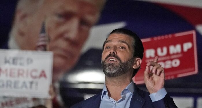 FILE - In this Nov. 5, 2020, file photo Donald Trump Jr., gestures during a news conference at Georgia Republican Party headquarters in Atlanta. A spokesman says President Donald Trump’s eldest son, Donald Trump Jr., has been infected with the coronavirus.  The spokesman says the younger Trump learned his diagnosis earlier this week, has no symptoms and has been quarantining. (AP Photo/John Bazemore, File)