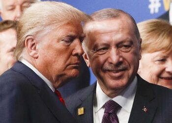 (FILES) In this file photo taken on December 4, 2019, US President Donald Trump (L) and Turkey's President Recep Tayyip Erdogan (R) leave the stage after the family photo to head to the plenary session at the NATO summit at the Grove hotel in Watford, northeast of London. - President Donald Trump has shattered through norms and niceties on the world stage in his nearly three years in office. Entering an election year, Trump is unlikely to slow down as he seeks what has largely eluded him -- a headline-grabbing victory. The tycoon turned president closes 2019 with a new stride after what was perhaps his most unambiguous achievement -- US commandos' raid that killed the leader of the Islamic State extremist group. But the year was also full of tosses and turns for Trump. On his ambition to end the war in Afghanistan, he startled Washington by inviting the Taliban to talks but then declared the talks dead before resuming them. (Photo by PETER NICHOLLS / POOL / AFP) (Photo by PETER NICHOLLS/POOL/AFP via Getty Images)