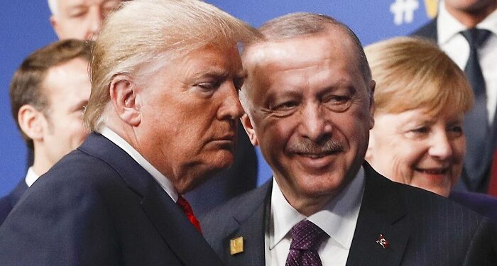 (FILES) In this file photo taken on December 4, 2019, US President Donald Trump (L) and Turkey's President Recep Tayyip Erdogan (R) leave the stage after the family photo to head to the plenary session at the NATO summit at the Grove hotel in Watford, northeast of London. - President Donald Trump has shattered through norms and niceties on the world stage in his nearly three years in office. Entering an election year, Trump is unlikely to slow down as he seeks what has largely eluded him -- a headline-grabbing victory. The tycoon turned president closes 2019 with a new stride after what was perhaps his most unambiguous achievement -- US commandos' raid that killed the leader of the Islamic State extremist group. But the year was also full of tosses and turns for Trump. On his ambition to end the war in Afghanistan, he startled Washington by inviting the Taliban to talks but then declared the talks dead before resuming them. (Photo by PETER NICHOLLS / POOL / AFP) (Photo by PETER NICHOLLS/POOL/AFP via Getty Images)